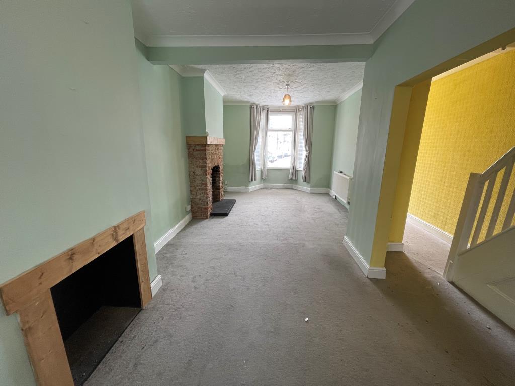 Lot: 152 - TWO-BEDROOM MID-TERRACE HOUSE - Living/dining room with fireplaces